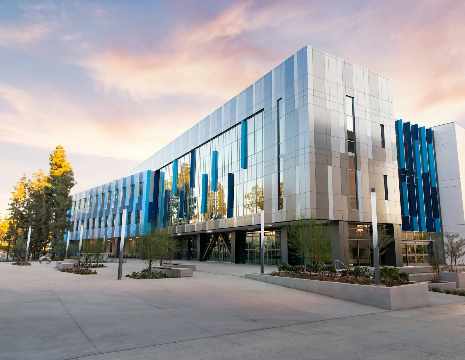 Modern three-storey commercial office building at sunset