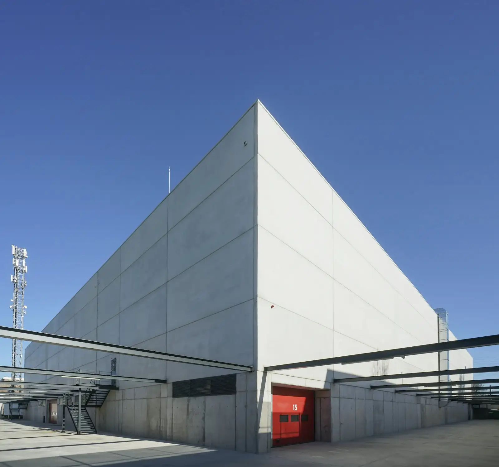 Modern concrete industrial building under a blue sky